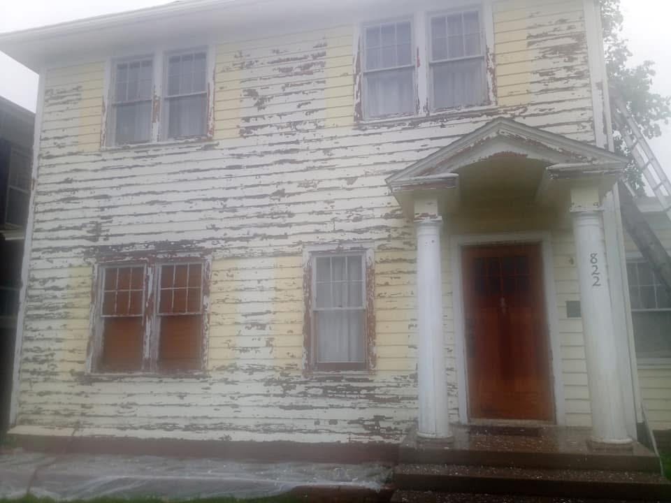 Blue two-story exterior before painting by Shields Painting